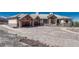 Elegant home with large driveway, beautiful landscaping, and a three-car garage at 1252 Rosewind Cir, Castle Rock, CO 80104