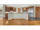 Open concept kitchen featuring custom wood cabinetry, stainless steel appliances, and a large island at 1252 Rosewind Cir, Castle Rock, CO 80104