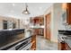 Modern kitchen featuring granite countertops, stainless steel appliances, and custom wood cabinetry at 1252 Rosewind Cir, Castle Rock, CO 80104