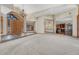 Large open concept living room featuring neutral paint, a chandelier, and entry to the kitchen at 1252 Rosewind Cir, Castle Rock, CO 80104