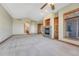 Spacious main bedroom featuring a fireplace, large windows, and access to the ensuite bathroom at 1252 Rosewind Cir, Castle Rock, CO 80104