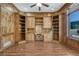 Home office featuring custom wood built-ins, cabinetry, and a large window with scenic views at 1252 Rosewind Cir, Castle Rock, CO 80104