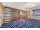 Spacious wine cellar featuring custom-built wooden racks and shelving for extensive wine storage at 1252 Rosewind Cir, Castle Rock, CO 80104