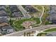 Aerial view of the community playground with nearby homes, streets, and sidewalks at 5297 Blue Lunar Ln, Castle Rock, CO 80104