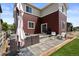 Inviting backyard with a patio area, outdoor seating, grill, and a charming fire pit for entertaining at 5297 Blue Lunar Ln, Castle Rock, CO 80104