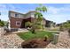 Cozy backyard featuring artificial grass, rock landscaping, and outdoor seating area with comfortable furnishings at 5297 Blue Lunar Ln, Castle Rock, CO 80104