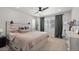 Comfortable bedroom featuring a ceiling fan and a neutral color scheme at 5297 Blue Lunar Ln, Castle Rock, CO 80104