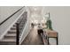 Welcoming foyer showcasing hardwood floors, staircase, and stylish console table with decor at 5297 Blue Lunar Ln, Castle Rock, CO 80104