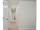 Neutral hallway with carpet flooring showcases multiple doorways for access to other rooms at 5297 Blue Lunar Ln, Castle Rock, CO 80104