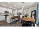 Modern kitchen featuring stainless steel appliances, a granite island with seating, and bright cabinetry at 5297 Blue Lunar Ln, Castle Rock, CO 80104