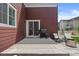 Back patio featuring concrete, a gas grill, outdoor chairs, and a sliding glass door at 5297 Blue Lunar Ln, Castle Rock, CO 80104