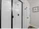 Modern bathroom shower with black trim and a tiled interior at 5297 Blue Lunar Ln, Castle Rock, CO 80104