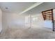Spacious unfinished basement with carpet and stairs at 1207 S Memphis St, Aurora, CO 80017