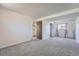 Neutral bedroom has carpet flooring, a closet, and a window at 1207 S Memphis St, Aurora, CO 80017