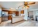 Open kitchen with stainless steel appliances, granite countertops, tile backsplash, and tile flooring at 1207 S Memphis St, Aurora, CO 80017