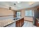 Granite countertops grace this kitchen island with a stainless steel sink, perfect for entertaining at 1207 S Memphis St, Aurora, CO 80017
