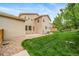 Spacious backyard features lush green grass and a patio, perfect for outdoor activities and relaxation at 4850 Bluegate Ln, Highlands Ranch, CO 80130