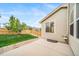 Fenced backyard features a patio, green grass, and manicured landscaping providing a great outdoor living space at 4850 Bluegate Ln, Highlands Ranch, CO 80130