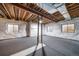 Partially finished basement featuring exposed ceiling, foundation insulation, and carpeted floor, a blank canvas for your design at 4850 Bluegate Ln, Highlands Ranch, CO 80130