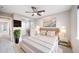 Comfortable bedroom with a ceiling fan and a wall mounted television at 4850 Bluegate Ln, Highlands Ranch, CO 80130