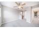 Bedroom highlighting a ceiling fan, carpet and an attached study nook, offering comfort and convenience at 4850 Bluegate Ln, Highlands Ranch, CO 80130
