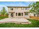 A view of the home's rear exterior featuring a patio and fenced yard at 4850 Bluegate Ln, Highlands Ranch, CO 80130