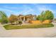 Attractive home with a cozy front porch and well-manicured landscaping at 4850 Bluegate Ln, Highlands Ranch, CO 80130