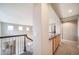 Upstairs hallway featuring granite countertops and cabinetry at 4850 Bluegate Ln, Highlands Ranch, CO 80130