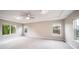 Spacious main bedroom with tray ceilings, fan, and large windows at 4850 Bluegate Ln, Highlands Ranch, CO 80130