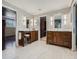 Spacious bathroom with and vanities, a walk-in closet, and modern lighting at 9931 E Ida Pl, Greenwood Village, CO 80111