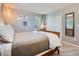 Cozy bedroom with a wood-frame bed, a white closet door, and modern decorative elements at 9931 E Ida Pl, Greenwood Village, CO 80111