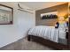 This bedroom features neutral colors, closet space, and a window to provide a comfortable private space at 9931 E Ida Pl, Greenwood Village, CO 80111