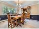 Formal dining room featuring natural light and an ornate china cabinet at 9931 E Ida Pl, Greenwood Village, CO 80111