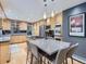 Open-concept kitchen with stainless steel appliances and granite countertop island with seating at 9931 E Ida Pl, Greenwood Village, CO 80111