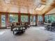 Bright living room featuring wood ceilings, brick accents, and large windows at 9931 E Ida Pl, Greenwood Village, CO 80111
