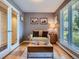 Cozy sitting area with natural light, comfortable sofa, and hardwood floors at 9931 E Ida Pl, Greenwood Village, CO 80111