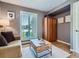 Serene sitting room with natural light, hardwood floors, and tranquil decor at 9931 E Ida Pl, Greenwood Village, CO 80111