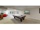 Spacious basement featuring a pool table, carpeted flooring, and ample lighting at 7567 Parkview Mtn, Littleton, CO 80127