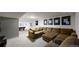 A finished basement features a large brown sectional, pool table, and carpeted flooring at 7567 Parkview Mtn, Littleton, CO 80127