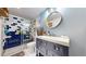 Charming bathroom featuring unique blue and white tiling in the shower and modern fixtures at 7567 Parkview Mtn, Littleton, CO 80127