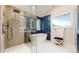Modern bathroom with a glass-enclosed shower, freestanding tub, and contemporary fixtures at 7567 Parkview Mtn, Littleton, CO 80127