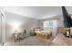 Cozy bedroom features a bed, desk, and window with natural light, creating a comfortable space at 7567 Parkview Mtn, Littleton, CO 80127