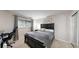 A modern bedroom with a comfortable bed and a desk area next to a window with natural light at 7567 Parkview Mtn, Littleton, CO 80127