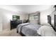 Bedroom with a black frame bed, and a desk area next to a window with natural light at 7567 Parkview Mtn, Littleton, CO 80127