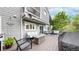 Inviting deck with cozy seating, a fire pit, and string lights for outdoor entertaining and relaxation at 7567 Parkview Mtn, Littleton, CO 80127