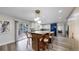 Bright kitchen with a large island, bar seating, and sliding glass doors to the outdoor deck at 7567 Parkview Mtn, Littleton, CO 80127