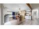 Open-concept kitchen showcases a spacious island with seating, designer finishes, and ample counter space at 7567 Parkview Mtn, Littleton, CO 80127