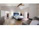 Bright main bedroom featuring vaulted ceilings, a sitting area, and ample closet space at 7567 Parkview Mtn, Littleton, CO 80127