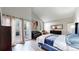 Comfortable main bedroom featuring vaulted ceilings, a balcony access, and ample closet space at 7567 Parkview Mtn, Littleton, CO 80127