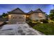 Charming single Gathering home featuring stone accents, attached garage and well maintained lawn at 6652 W Asbury Pl, Lakewood, CO 80227
